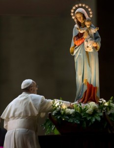 Pope Francis pays homage to a statue of the Virgin Mary during a ceremony to mark the closure of the month dedicated to the Virgin Mary, in St. Peter's Square, at the Vatican, Friday, May 31, 2013. (AP Photo/Alessandra Tarantino)